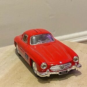 Vintage Red Toy Car with Silver Accents